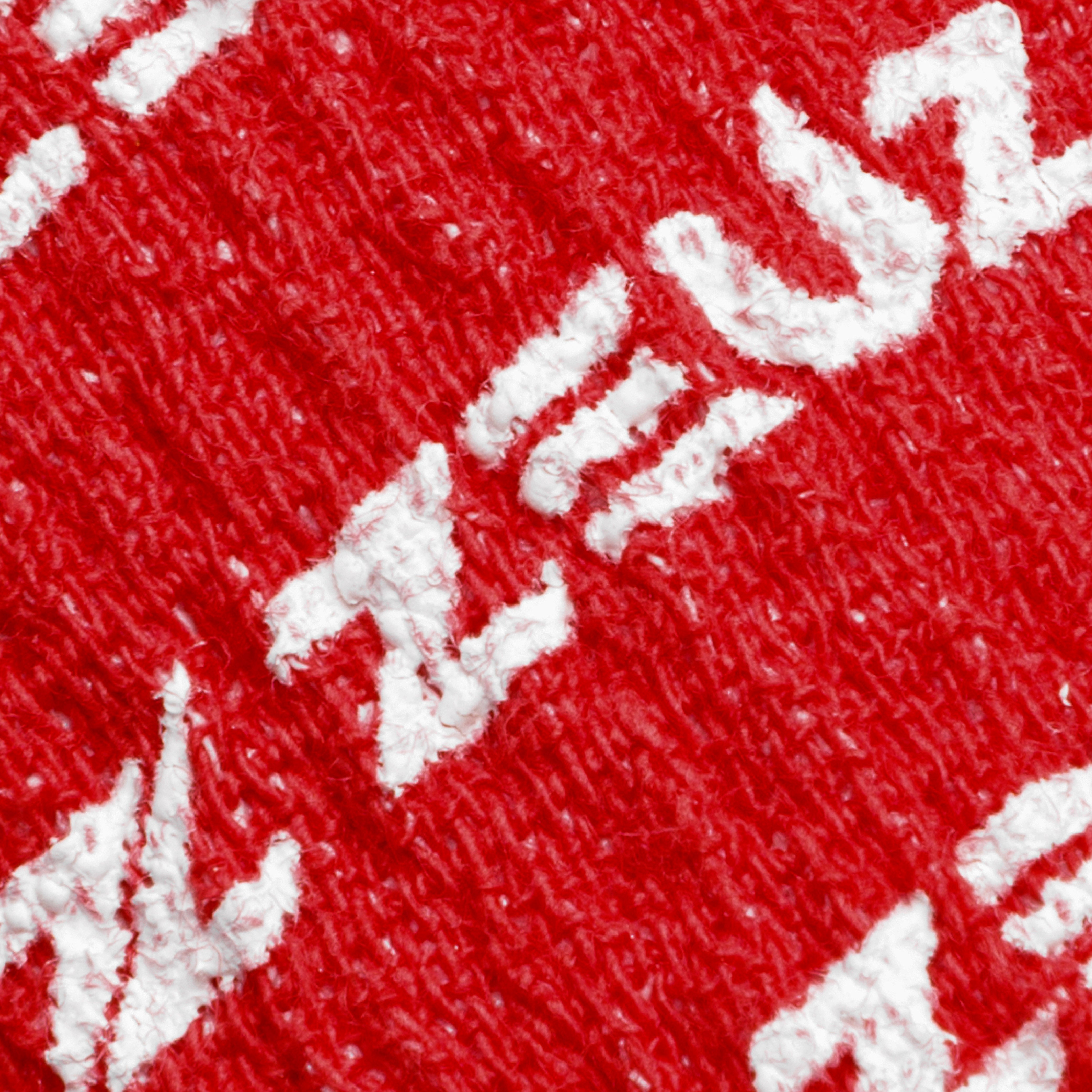 Detail van de structuur en print van ZEUZ Gewichthef Tape rood