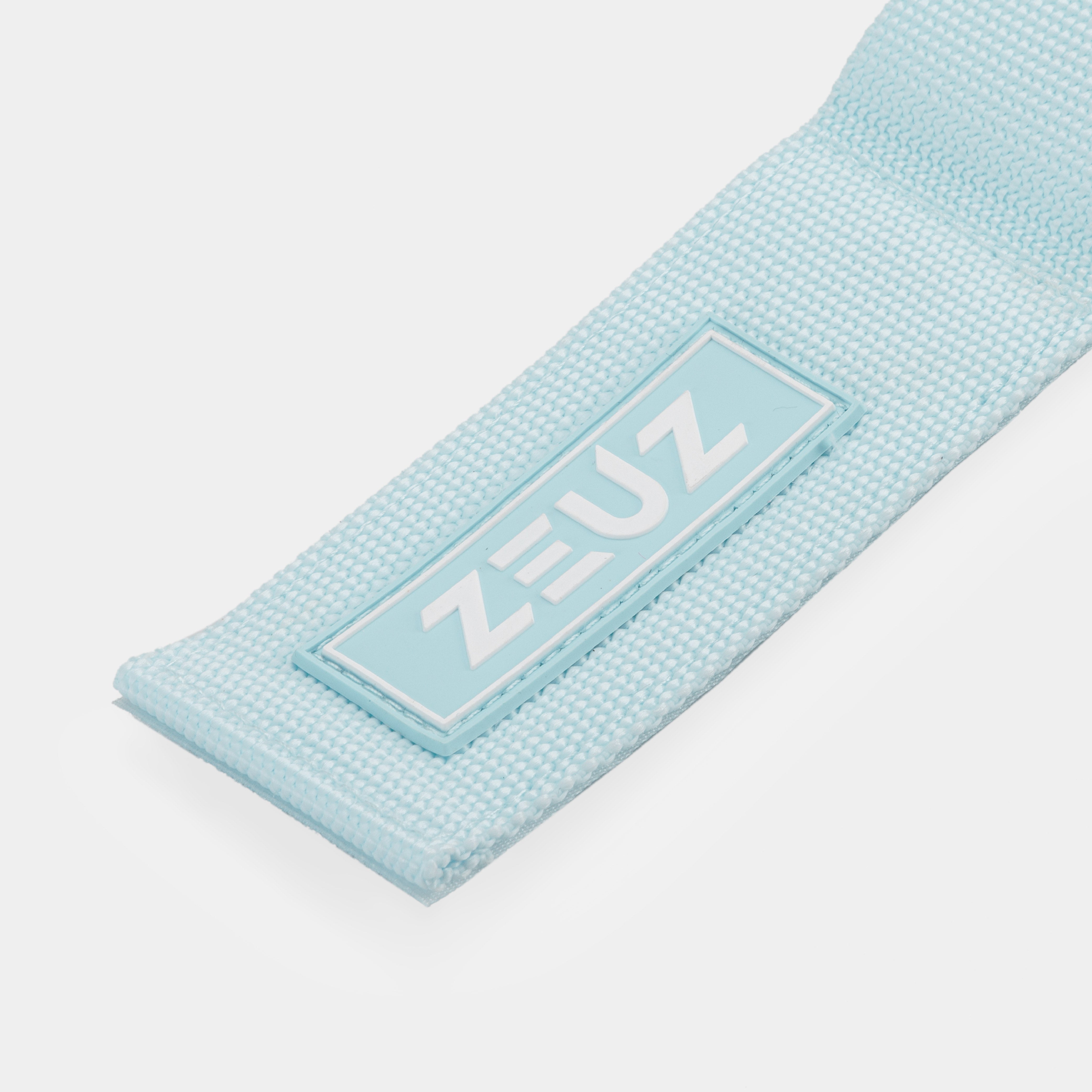 Detail van het ZEUZ-logo op de Ankle Straps blauw – rubber label