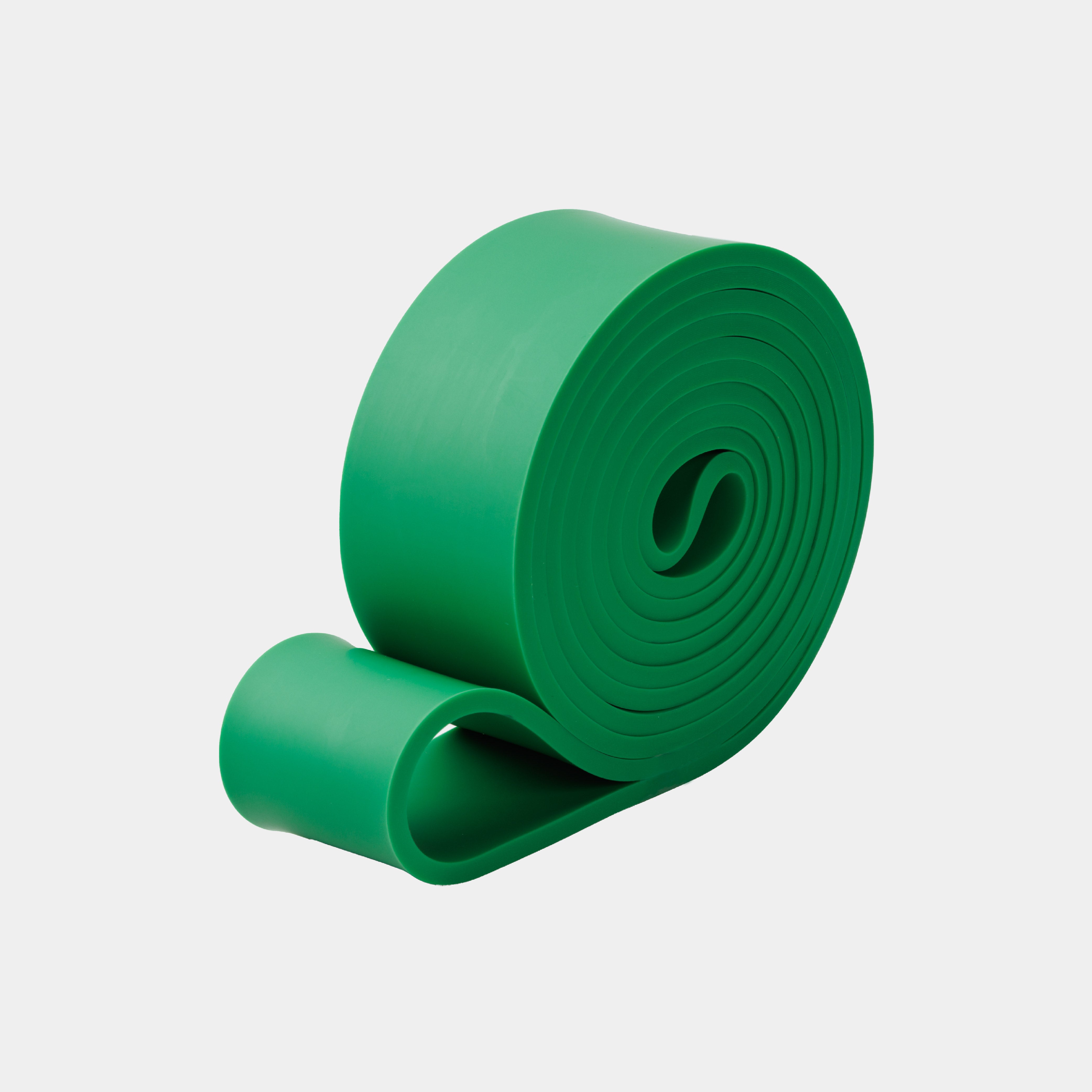 ZEUZ Powerband groen opgerold – compacte en duurzame weerstandsband (22 tot 56 kg)