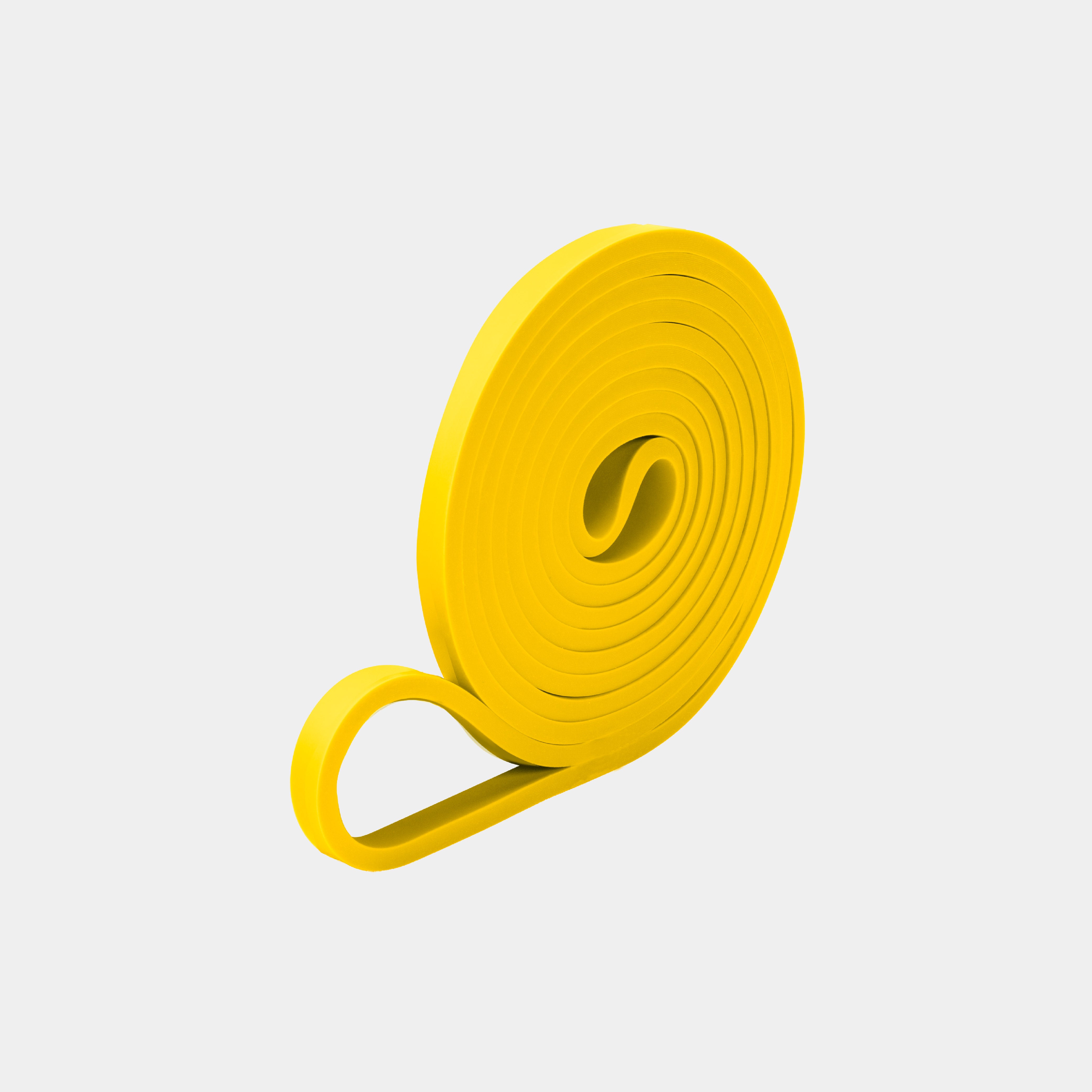 ZEUZ Powerband geel opgerold – compacte en duurzame weerstandsband (2 tot 5 kg)