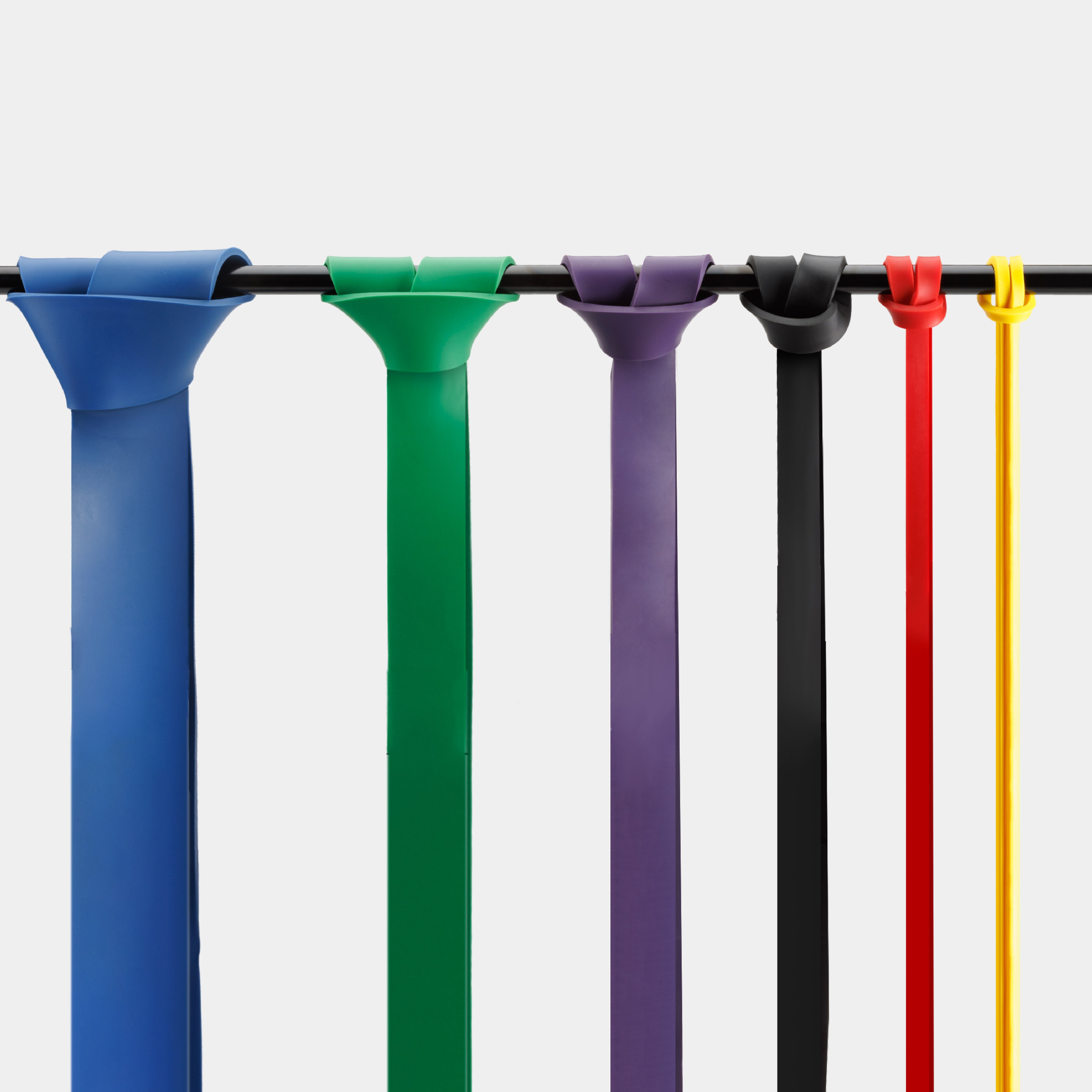 ZEUZ Powerbands set – banden geknoopt om een stang voor kracht- of mobiliteitstraining