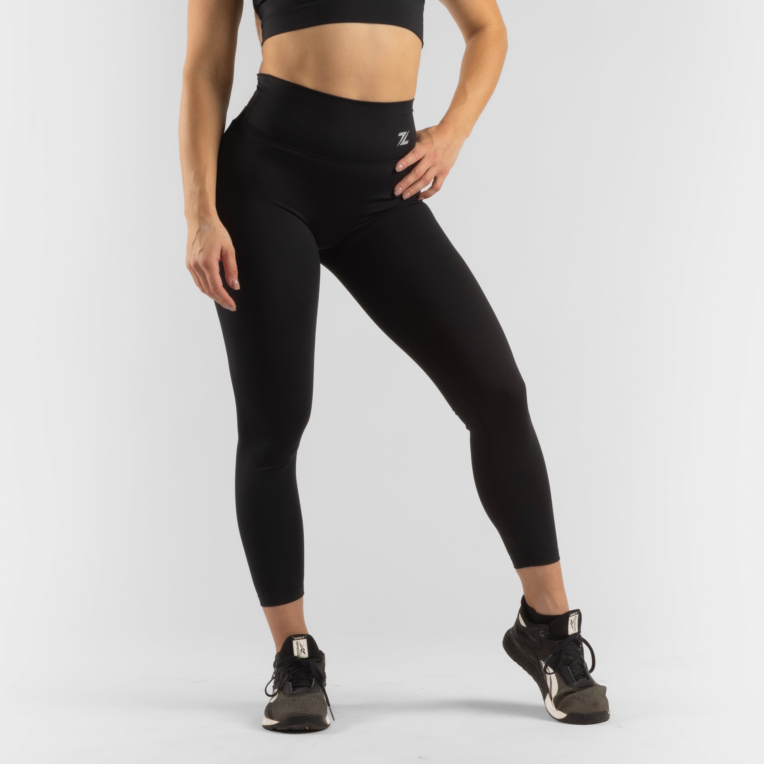 ZEUZ Sportlegging lang zwart – voorkant met hoge tailleband en strakke pasvorm